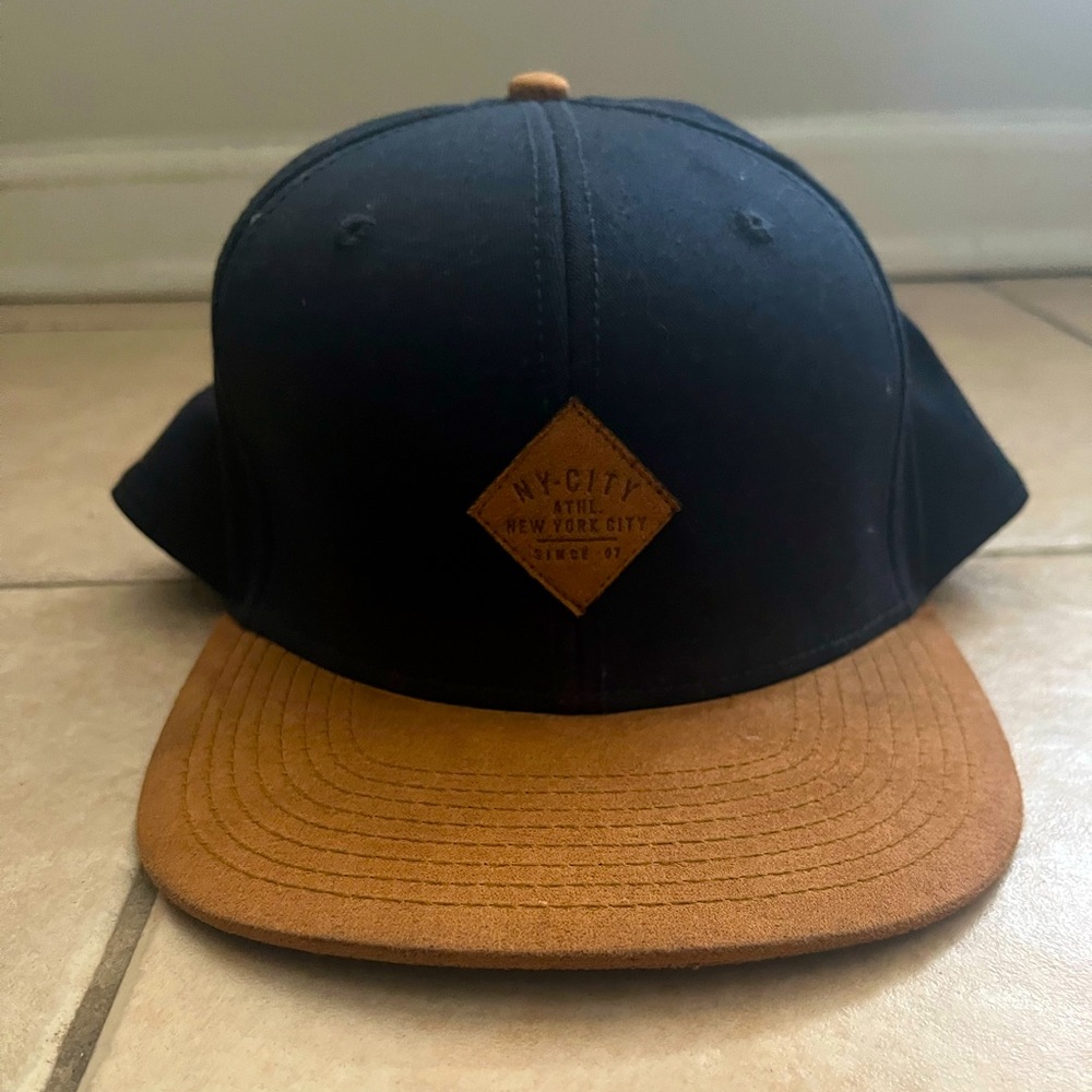 NY SnapBack ball cap. Navy Blue/Brown